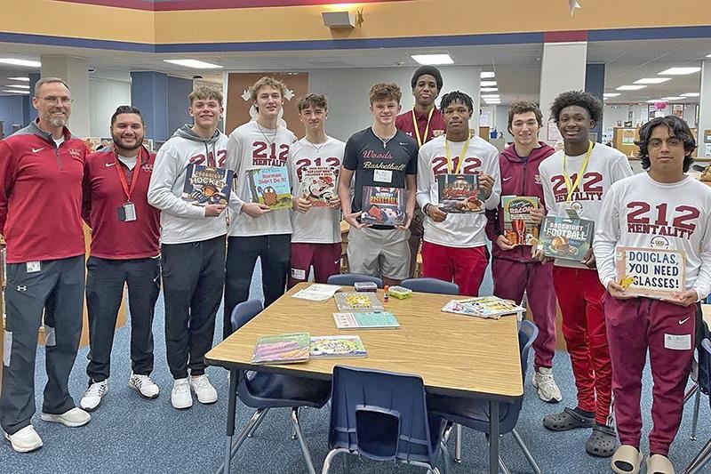 Members of the Cypress Woods High School basketball team visited Sampson Elementary School to read to third grade students.